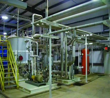 A large industrial building with pipes and valves.