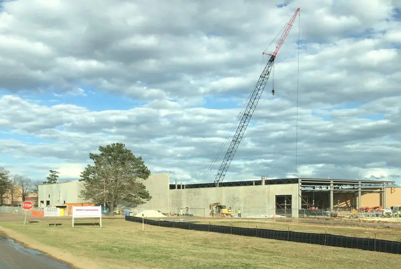 A crane is in the sky over a building.